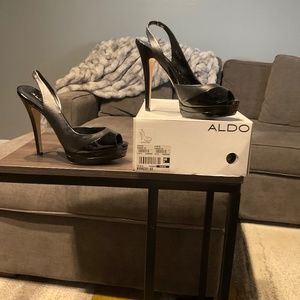 Black sling and peep toe/plat form heel